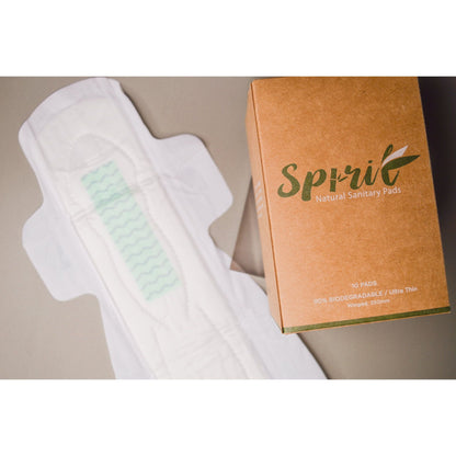 Spirit Eco Health Sanitary Pads in brown and green. Open maxi pad next to Spirit Eco health sanitary pad pack of 10.