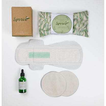 gift hampers. gift baskets. gifts for new mums in green and white. Massage Oil, Maternity pad. Breast Pad. Heat Pack.