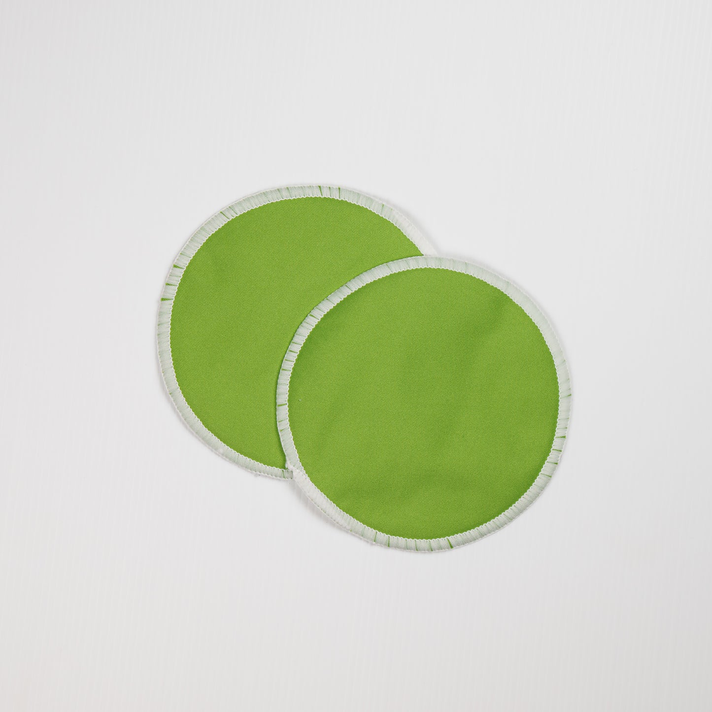 Green Reusable Breast Pads. Front of Washable Nursing Pads