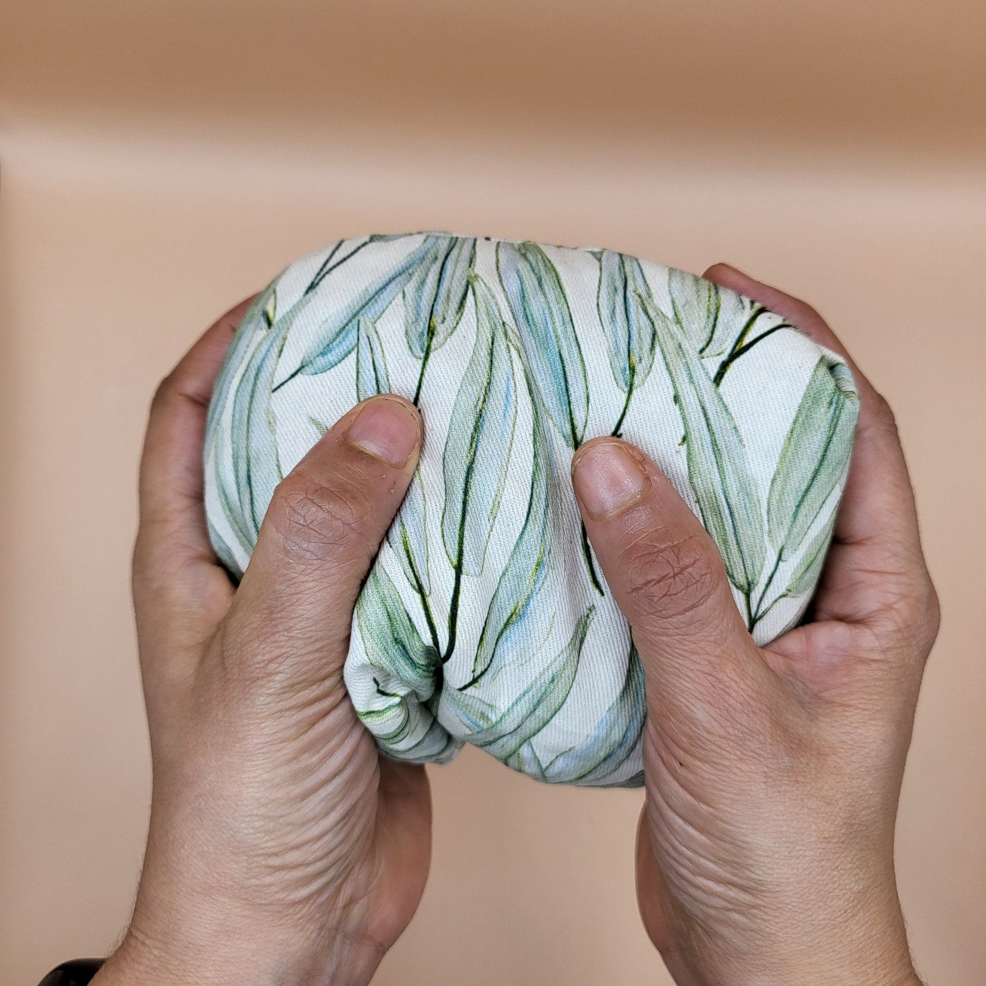 Spirit Microwave Heat Pad in hands of a woman